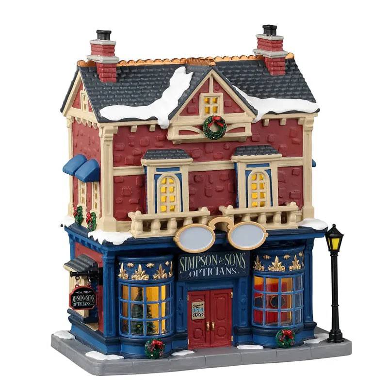 Simpson & Sons Opticians Lemax Christmas Village Illuminated Village